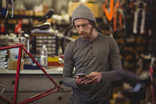 Mechanic using mobile phone