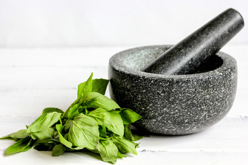 cooking spices in mortar home at wooden background