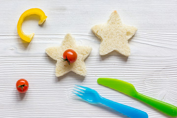 Fototapeta na wymiar cooking breakfast for kid star sandwiches top view