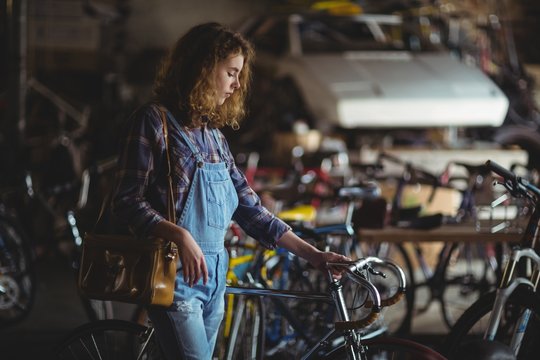 Mechanic examining a bicycle handle bar