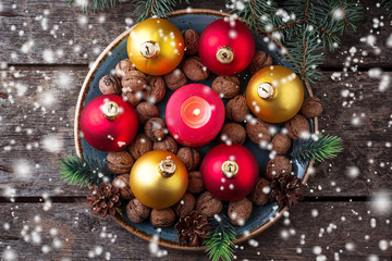 Red and golden Christmas balls on plate