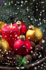 Red and golden Christmas balls on plate