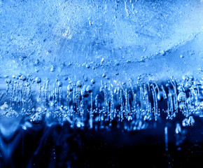 Micro air bubbles in the ice frozen during their movement to the water surface. 1 : 1 macro lens shot