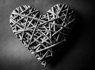 (withe, withy, osier, sallow, vine) braided on a frame in the form of hearts isolated on a white...