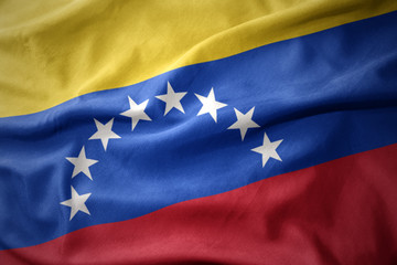 Naklejka premium waving colorful flag of venezuela.