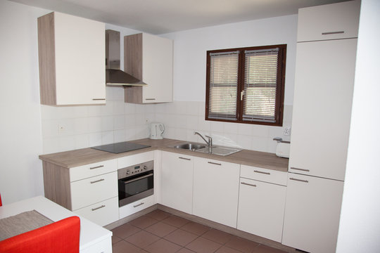 White new modern kitchen interior with oven