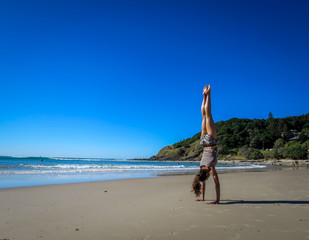 A handstand on the beach