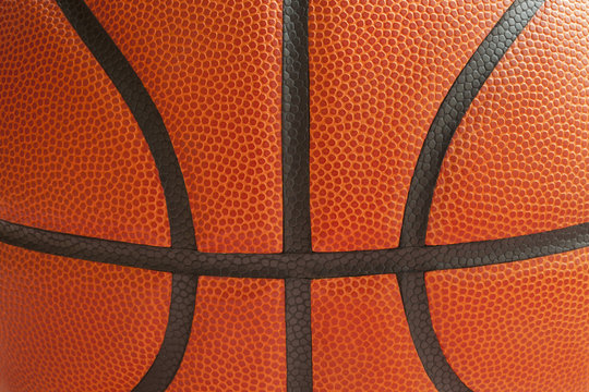 Close up shot of a basketball showing the seams