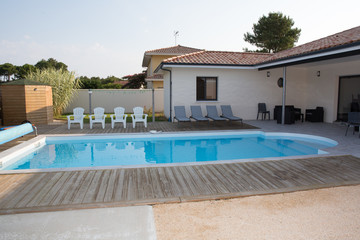 Swimming pool with chair at hotel close up