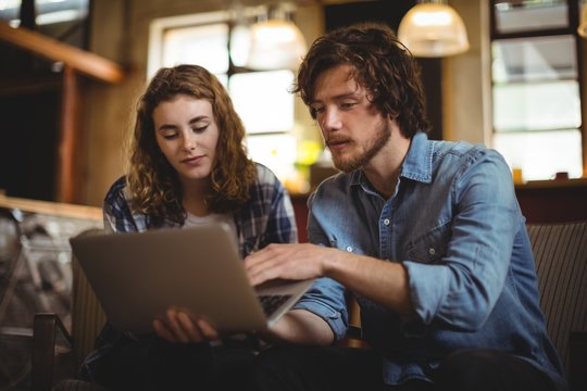 Couple using laptop