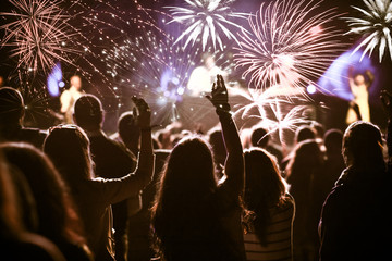 Fototapeta na wymiar cheering crowd and fireworks