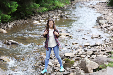 Young woman on beautiful river landscape