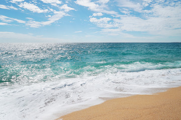 Sand, sea and beautiful blue sky with clouds