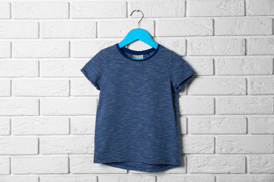 Blank color t-shirt against brick wall