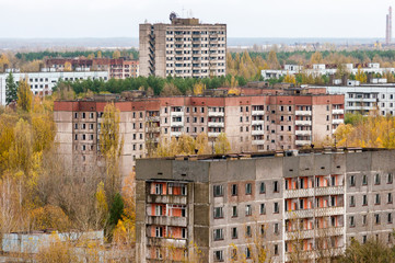Pripyat city exclusion zone from the high empty abandoned building. Autumn time. Chernobyl, Ukraine - obrazy, fototapety, plakaty