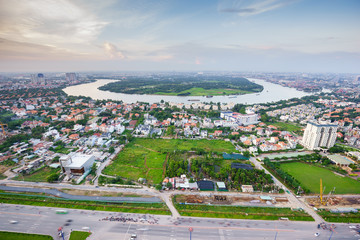 Panoramic view of Thanh Da peninsula, Ho Chi Minh city (aka Saigon) in sunset, Vietnam. Ho Chi Minh city is the largest city and economic center in Vietnam with population around 10 million people.