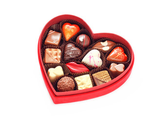 Red velvet, heart shaped box of chocolates. Shot on white backgr