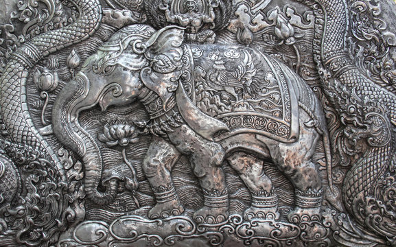 Decorative Art of Lanna Thai silver carving art on temple wall .