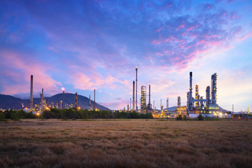 Fototapeta na wymiar Oil refinery industry at sunrise, Oil refiner Industry background concept