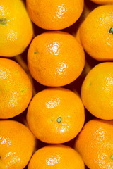 Closeup of  oranges on a market on background