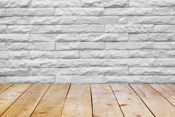 Wood table top on bricks wall.