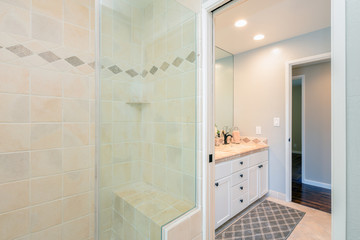 Fototapeta na wymiar Modern bathroom interior with glass door shower