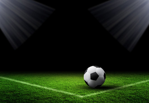 Soccer Ball and Grass on dark background 