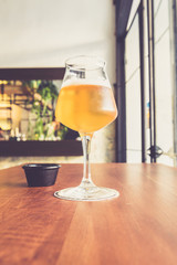 Beer glass on the bar counter vintage filter