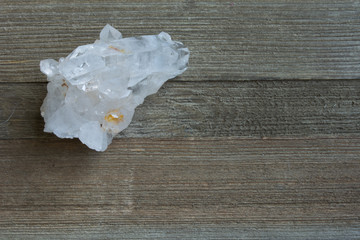 Quartz Crystal Cluster on Wood Background