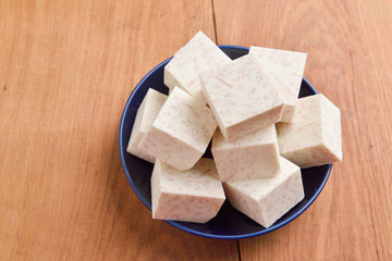 Taro on wood table background