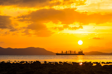 beautiful sunset over sea silhouette big boat