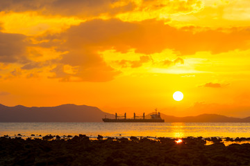 beautiful sunset over sea silhouette big boat