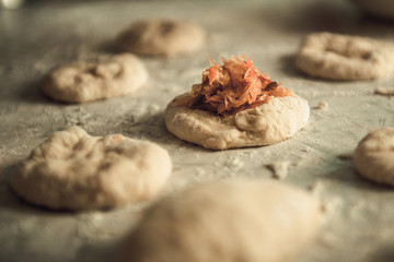homemade cakes of the dough in the women's hands