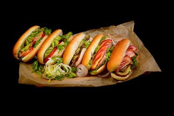 hot dog with meat on a black background
