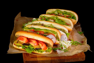 hot dog with eggplant on a black background