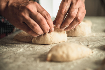 homemade cakes of the dough in the women's hands