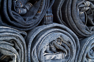 Background of a stack rolled jeans