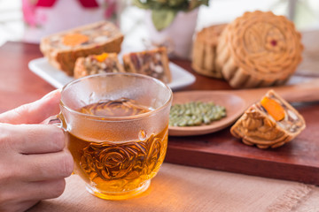 Moon cake in woman hands