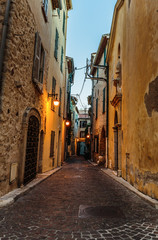 Fototapeta na wymiar Narrow street in the old town Antibes in France. Night view