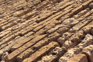 Old brick wall of a medieval fortress