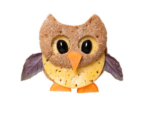 Owl made of bread and cheese on white background