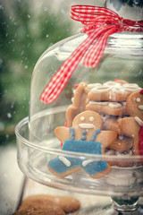Christmas Gingerbread cookie on glass stand with snow flakes 