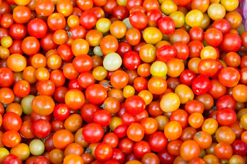 background with fresh red tomatoes in market