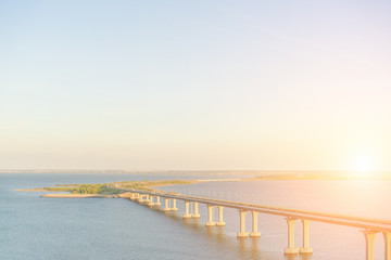 Obraz premium Road bridge across the river in the sunlight