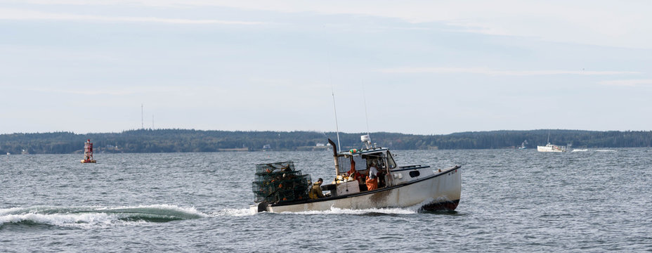 Lobster Fishermen In Maine Returning Home With Their Catch