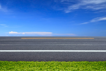 Green grass on road.