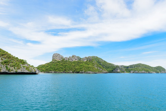 Summer seascape ,blue sea ,green island with blue sky background