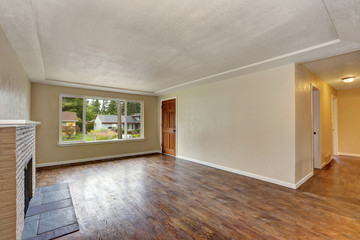 Unfurnished beige living room interior in empty house