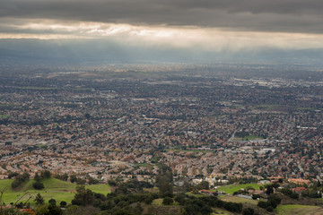 Aerial View of the Silicon Valley, Green Countryside, and Ominous Sky. San Jose and Southern Silicon Valley as seen from Mount Hamilton in the Fall of 2016.