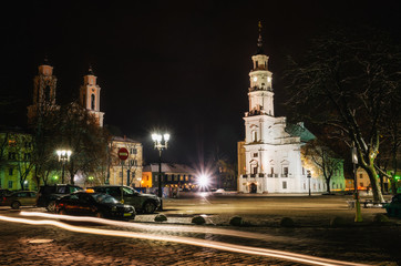 Fototapeta na wymiar The Town Hall in Old Town of Kaunas with St. Francis Xavier Church at night, Lithuania